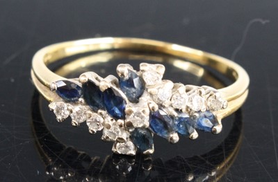 Lot 331 - An 18ct yellow and white gold, sapphire and...