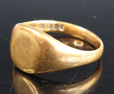 Lot 352 - An 18ct yellow gold cushion shaped signet ring,...