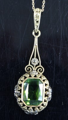 Lot 325 - A yellow metal peridot set pendant, comprising...