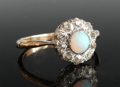 Lot 2504 - A yellow and white metal, opal and diamond...