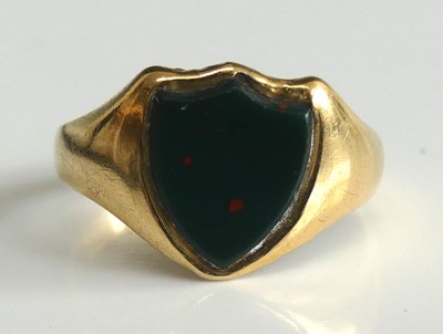 Lot 2508 - An 18ct yellow gold shield shaped bloodstone...