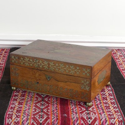 Lot 1089 - A late Regency rosewood and cut brass inlaid...