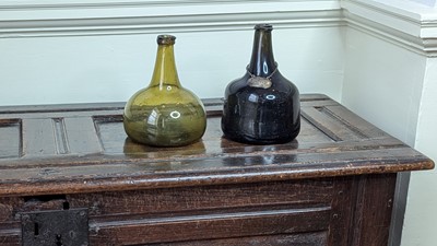 Lot 1062 - A green glass wine bottle, 18th century, of...