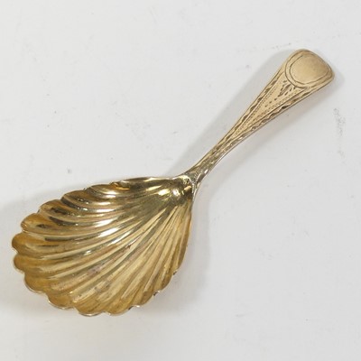 Lot 317 - A George III silver gilt caddy spoon, having a...