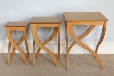 Lot 1324 - A nest of three contemporary graduated satin...