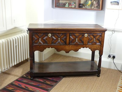 Lot 1329 - An early 18th century joined oak dresser base,...