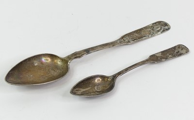 Lot 311 - A continetal white metal tablespoon, together...