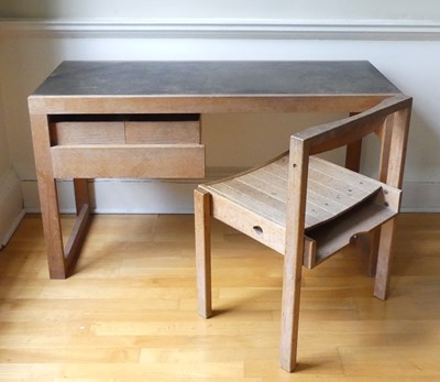 Lot 1289 - Dick Russell, a limed oak writing desk having...