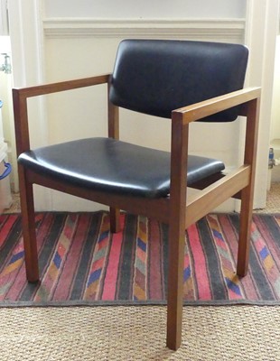 Lot 1309 - A 1960s British teak desk chair, having padded...