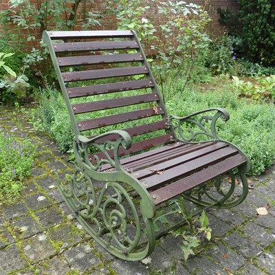 Lot 1341 - A cast iron green painted and slatted wood...