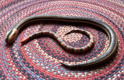 Lot 1080 - A softwood and polychrome painted articulated...