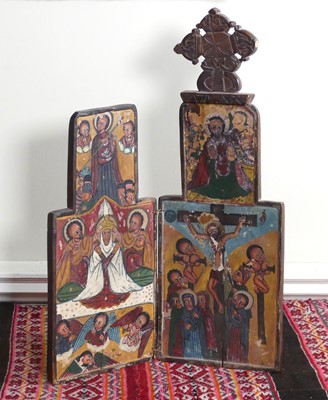 Lot 1102 - A medieval style relief carved and stained...