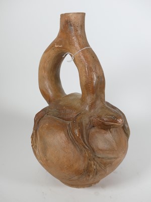 Lot 11 - A pre-Columbian style pottery stirrup vessel,...