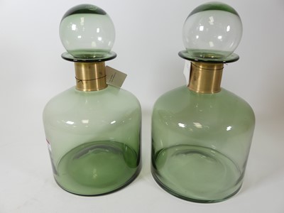 Lot 21 - A pair of large green glass bottles & stoppers,...