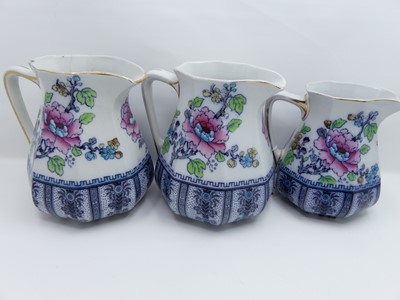 Lot 23 - A pair of Lossol ware Shanghai pattern jugs,...