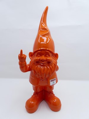 Lot 25 - An orange composite garden gnome, height 40cm