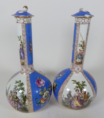 Lot 29 - A pair of continental bottle vases and covers,...