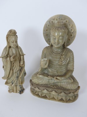 Lot 39 - A carved green hardstone figure of a buddha,...