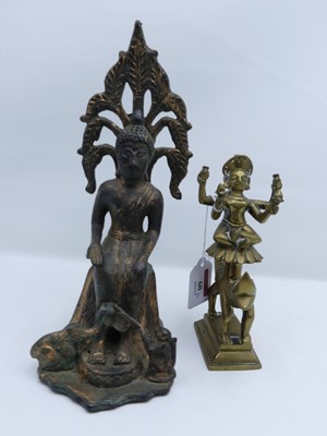 Lot 60 - An Asian patinated metal figure of buddha...