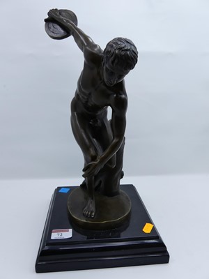 Lot 72 - A bronzed metal figure of Discobolus, modelled...