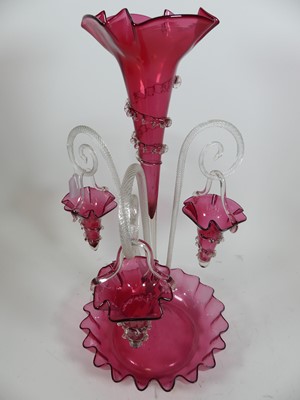 Lot 165 - A Victorian cranberry glass three-branch table...