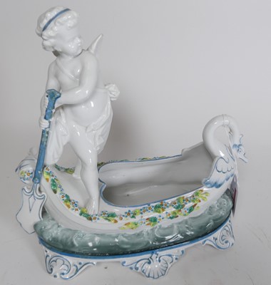 Lot 173 - A Depose porcelain figure of a cherub driving...