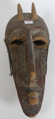 Lot 177 - An African copper clad tribal mask, height 45cm