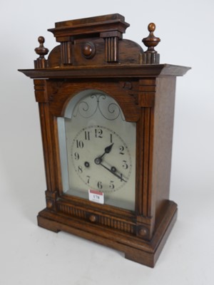 Lot 178 - An early 20th century oak cased mantel clock,...