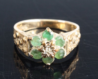 Lot 356 - A 9ct gold emerald and diamond point flower...