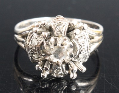 Lot 367 - A white metal diamond dress ring arranged as a...