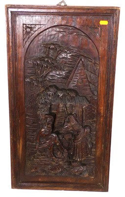 Lot 1010 - A continental relief carved oak panel in frame,...