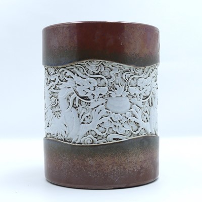 Lot 208 - A Chinese pottery brush pot, relief decorated...