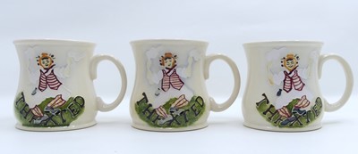 Lot 225 - A set of three Moorcroft pottery mugs, each...