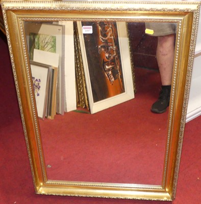 Lot 1097 - A gilt composition framed and bevelled...