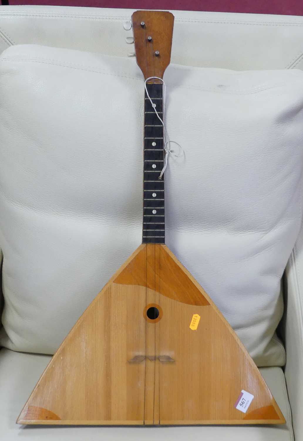 Lot 567 - A Russian Balalaika three-stringed instrument,...