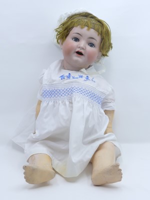 Lot 570 - An early 20th century bisque head doll by...