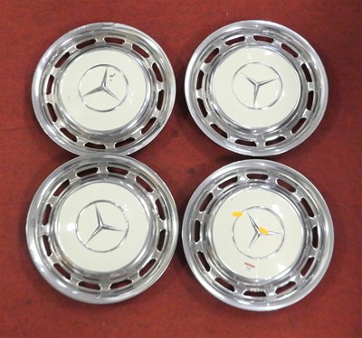 Lot 546 - A set of four Mercedes chrome hubcaps, each...