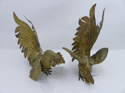 Lot 513 - A pair of brass table cockerels, the largest h....