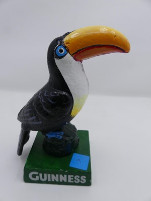 Lot 491 - A reproduction painted cast iron Guinness...