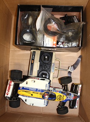 Lot 1676 - A box of radio controlled F1 models and a...