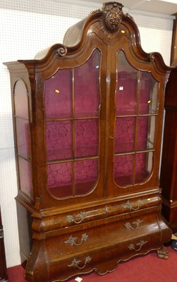 Lot 1152 - A 20th century Dutch figured walnut bombe...