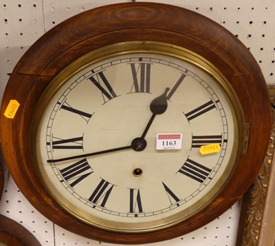 Lot 1163 - A stained beech circular wall clock, the white...