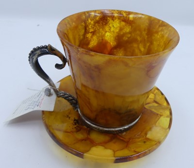 Lot 457 - A continental white metal mounted amber coffee...