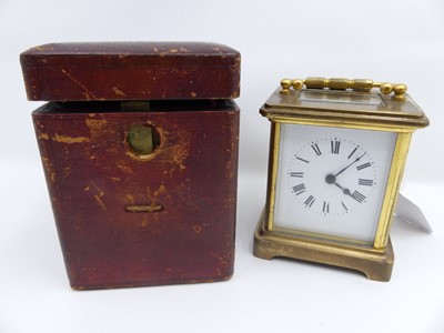 Lot 458 - A lacquered brass carriage clock having white...