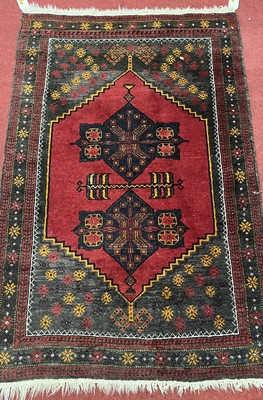 Lot 1171 - A small Persian red ground woollen Shiraz hall...