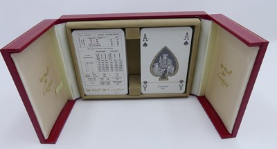 Lot 473 - Two sets of playing cards, in fitted gilt...