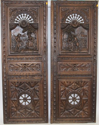 Lot 1191 - A pair of Flemish heavily relief carved oak...