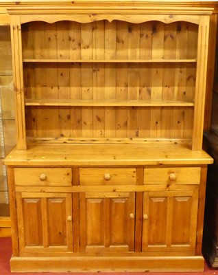 Lot 1197 - A contemporary stained pine kitchen dresser,...