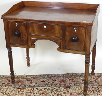 Lot 1238 - A circa 1830s mahogany kneehole wash stand...