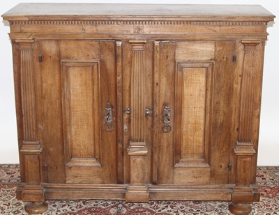 Lot 1253 - A provincial Spanish walnut double door side...